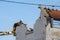 Selective blur on a construction worker, a demolition worker ready to demolish a residential house in France, in Arcachon.