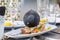 Selective blur on a pigeon standing on a restaurant table, scavenging food in a french cafe, in the city center of Bordeaux.