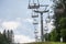 Selective blur on stopped ski lifts, not working in summer, in a ski resort, by slopes, in the middle of alpine mountain in Bled