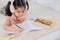 Selective focus adorable girl drawing creative art hobby activity on book, Cute primary school age girls drawing coloring picture