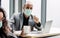 Selective Focus Adult smart  Caucasian businessman wearing formal suit and mask to protect virus, social distancing, working,