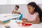 selective focus of african american kid with plasticine sculpturing figure