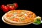 selective focus on appetizing Italian pizza with ham, cheese, sliced tomatoes, mustard and pickled cucumbers on round wooden boar