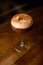 selective focus on a beautiful foamy drink in wine glass