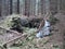 Selective focus of big rusty metal pieces in a creepy forest