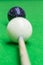 Selective focus on black snooker ball with blurred white snooker