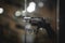 Selective focus, bokeh. background with old weapons. Revolver of old modification, close up, details of a firearm