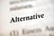 Selective focus from the book page of the word 'Alternative'