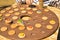 A selective focus of a boy who assembles a turret from the details of a wooden game.