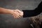 In selective focus of Business woman hand,shaking hands together,teamwork concept,for success deal,