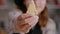 Selective focus of child holding cookie dough with tree shape in hands