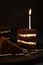 selective focus, chocolate sponge cake with birthday candle