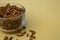 Selective focus closeup of a glass of dried carnation spices