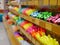 Selective focus of color pens on shelves in a stationary shop