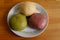 Selective focus of colorful handmade dough on plate with light and shadow, Three balls of fresh homemade wheat dough on kitchen