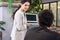 Selective focus at computer screen. Caucasian business women dress in formal suit holding laptop computer while meeting about work