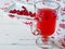 Selective focus on cranberries in a fresh drink in a glass cup