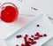 Selective focus on cranberries in a fresh drink in a glass cup