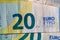 Selective focus on detail of euro banknotes. Close up macro detail of money banknotes, 20 euro isolated. World money concept,