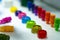 Selective focus on different type of plastic bottle cap of food and drink product. Green, yellow, red, pink, orange, blue