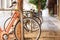 Selective focus on differently colored parked bicycles, on the street of Valencia, in Spain