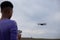 Selective focus on drone with teenager blurred