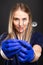 Selective focus of female dentist wearing scrubs showing tools