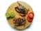 Selective focus of Fresh Crucifix Crab on a wooden pad Decorated with lemon slice and tomato slice . isolated on a White