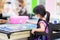 Selective focus. Girl wearing cloth face mask painting on canvas. Kid made art paint watercolor. Child in black apron uniform.