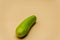 Selective focus glass cucumber on yellow background