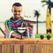 Selective focus on handsome, smiling Mexican bartender standing