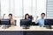 Selective focus of happy smiling call center business team with hands above heads in office, Office and business concept