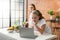 Selective Focus on Healthy women in a white bathrobe using laptop to find a vegetarian diet food recipe, ordering food online from