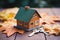 Selective focus: House model, key on wooden background, symbolic homeownership