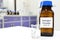 Selective focus of hydrogen peroxide solution in brown amber bottle. Blur laboratory background with copy space.