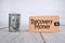 Selective focus image of bank note dollar with Recovery Money wording isolated in white background. Business and economy concept