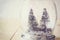 Selective focus image of christmas trees in mason jar. glitter overlay