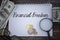 Selective focus image of magnifying glass  coin  bank note and spectacle with Keep Financial Freedom wording on a wooden