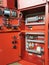 Selective focus image with noise effect red color sprinkler pump control panel interior in the factory.