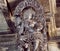 Selective focus on Indian woman in dance. Relief on ceiling of 12th century temple Hoysaleswara, India.