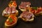 selective focus, Italian snack bruschetta, with tomatoes and smoked meats