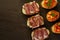 selective focus, Italian snack bruschetta, with tomatoes and smoked meats