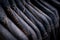 Selective focus on jacket jeans hanging on rack in clothes shop. Denim jeans with jeans pattern. Textile industry. Jeans fashion