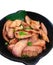 Selective focus on `Kau Moo Yang` Thai food put on banana leaf on black bowl