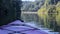 Selective focus of a kayak in a tranquil lake reflecting greenery in North Georgia, USA