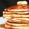 Selective focus layers of pancakes topped with syrup