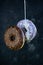 selective focus, levitating sweet doughnuts with chocolate and blueberry icing