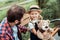 selective focus of little girl with teddy bear looking at father sitting near