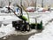 Selective focus. Machine for removing snow from pavements. Winter attack in Germany. Heavy snowfall in NRW in the Mettmann county