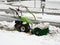 Selective focus. Machine for removing snow from pavements. Winter attack in Germany. Heavy snowfall in NRW in the Mettmann county.